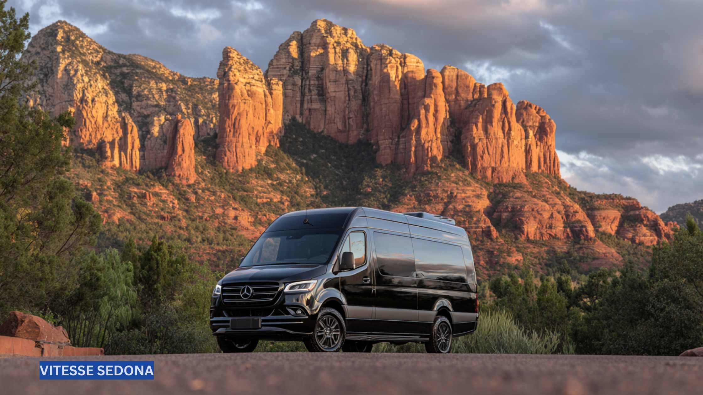Luxury Mercedes Sprinter van parked with Sedona’s iconic red rock formations in the background, showcasing comfort and style for group travel or events.