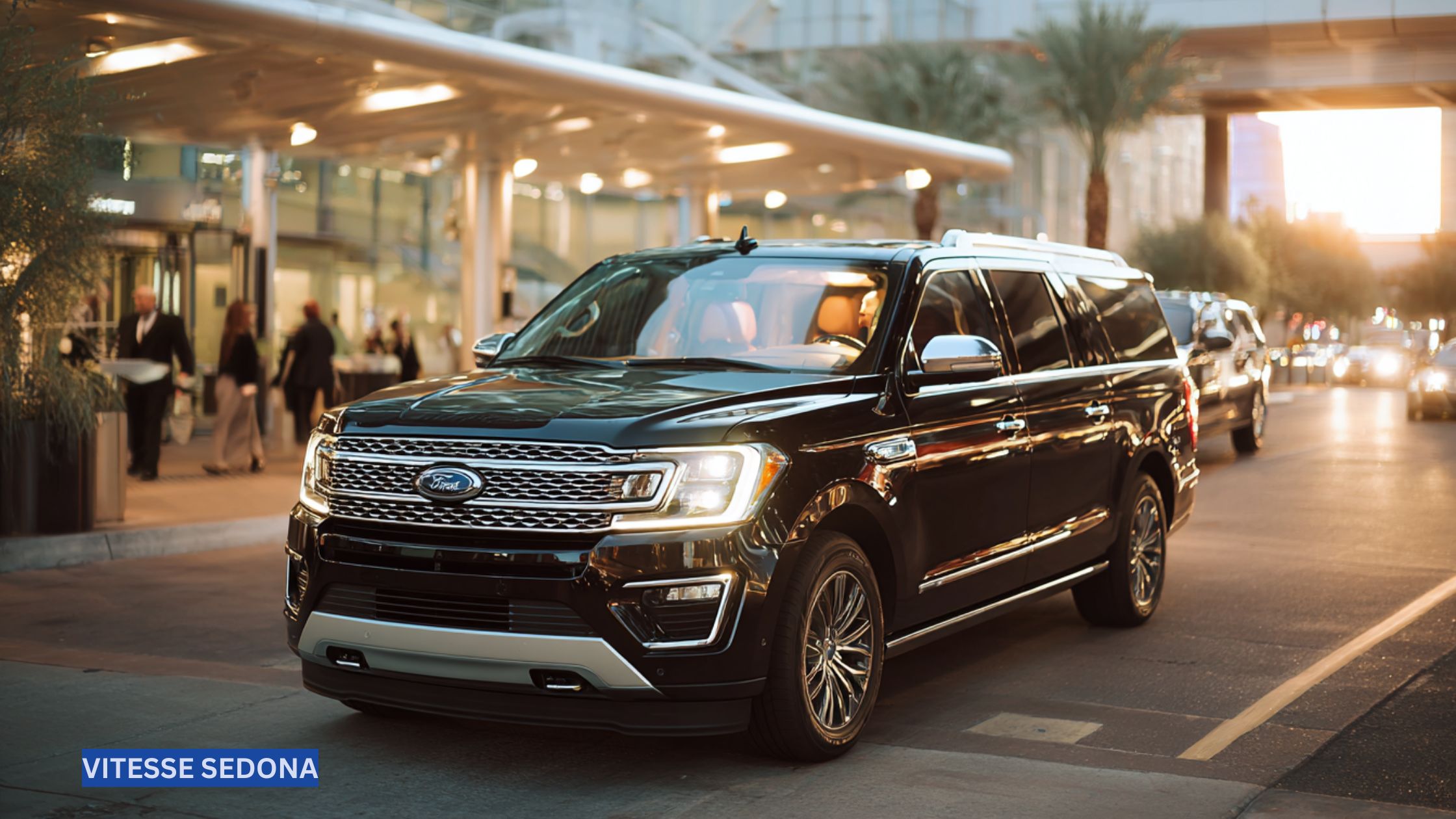 Black luxury SUV with professional driver arriving at Phoenix Sky Harbor Airport, ready for a premium transfer to Sedona.